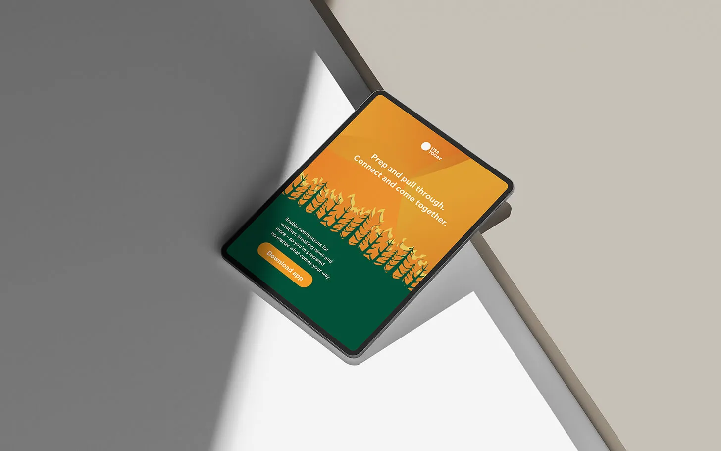 A WeatherAlert wildfire card on a tablet in hard light